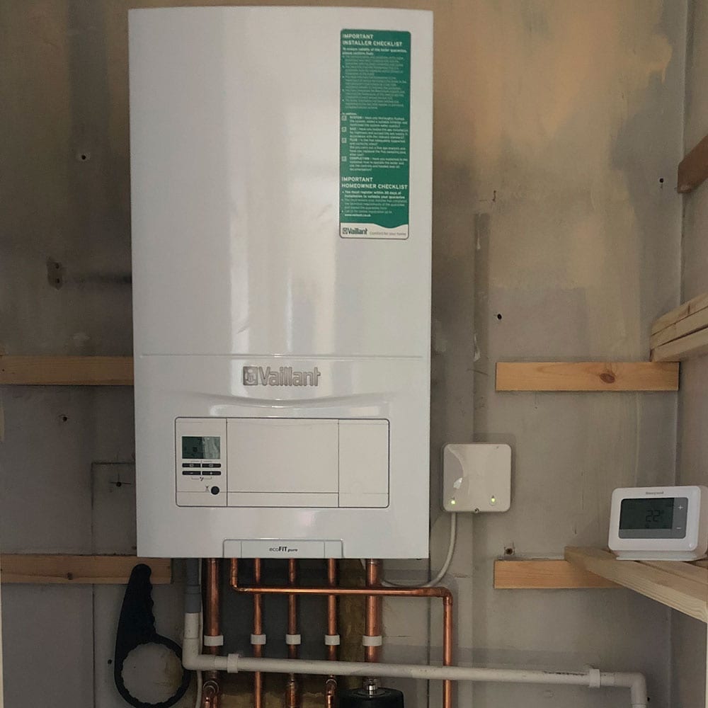 A white Vaillant boiler on a wall.